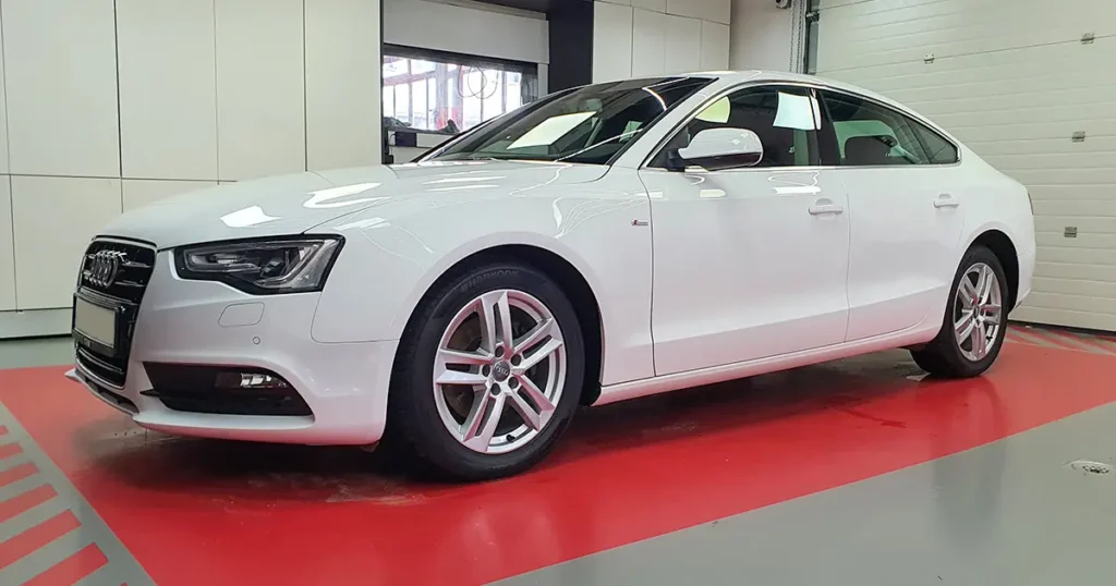 Clean white Audi A5 after professional exterior car wash and detailing service