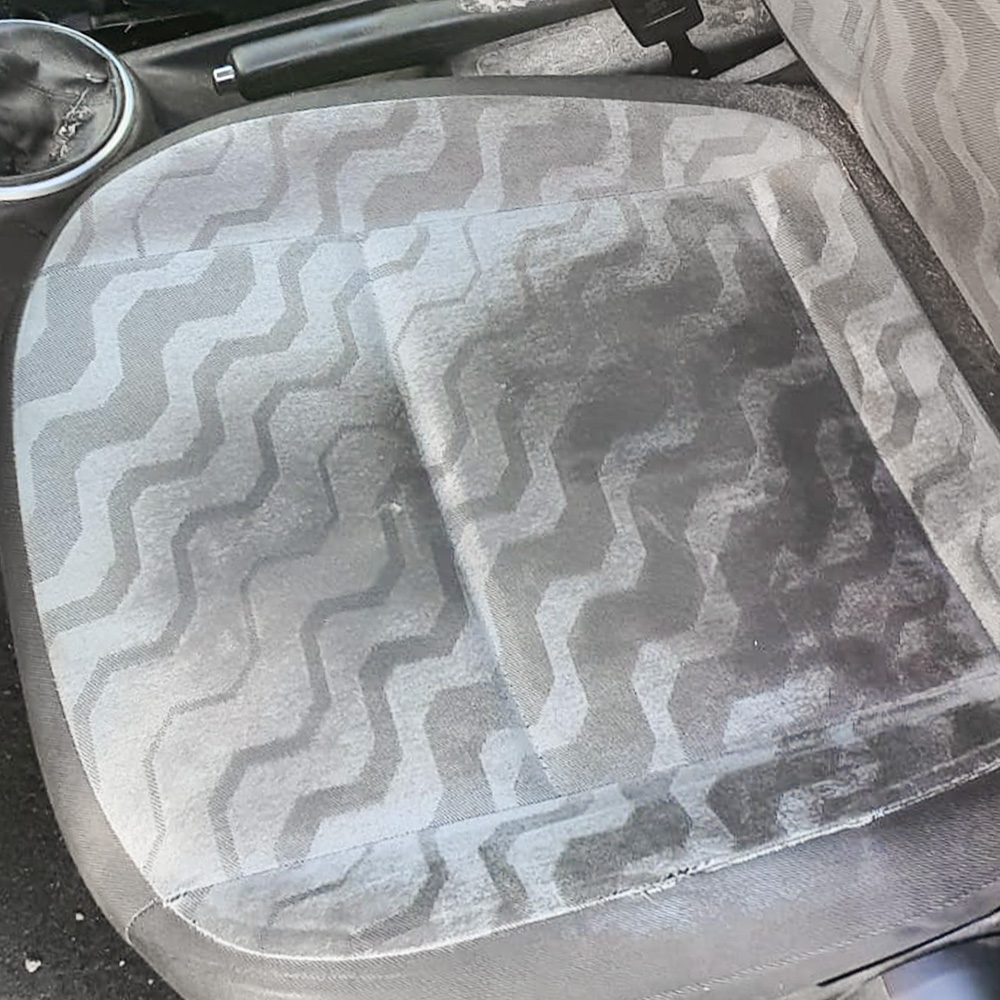 Stained car seat fabric before interior detailing
