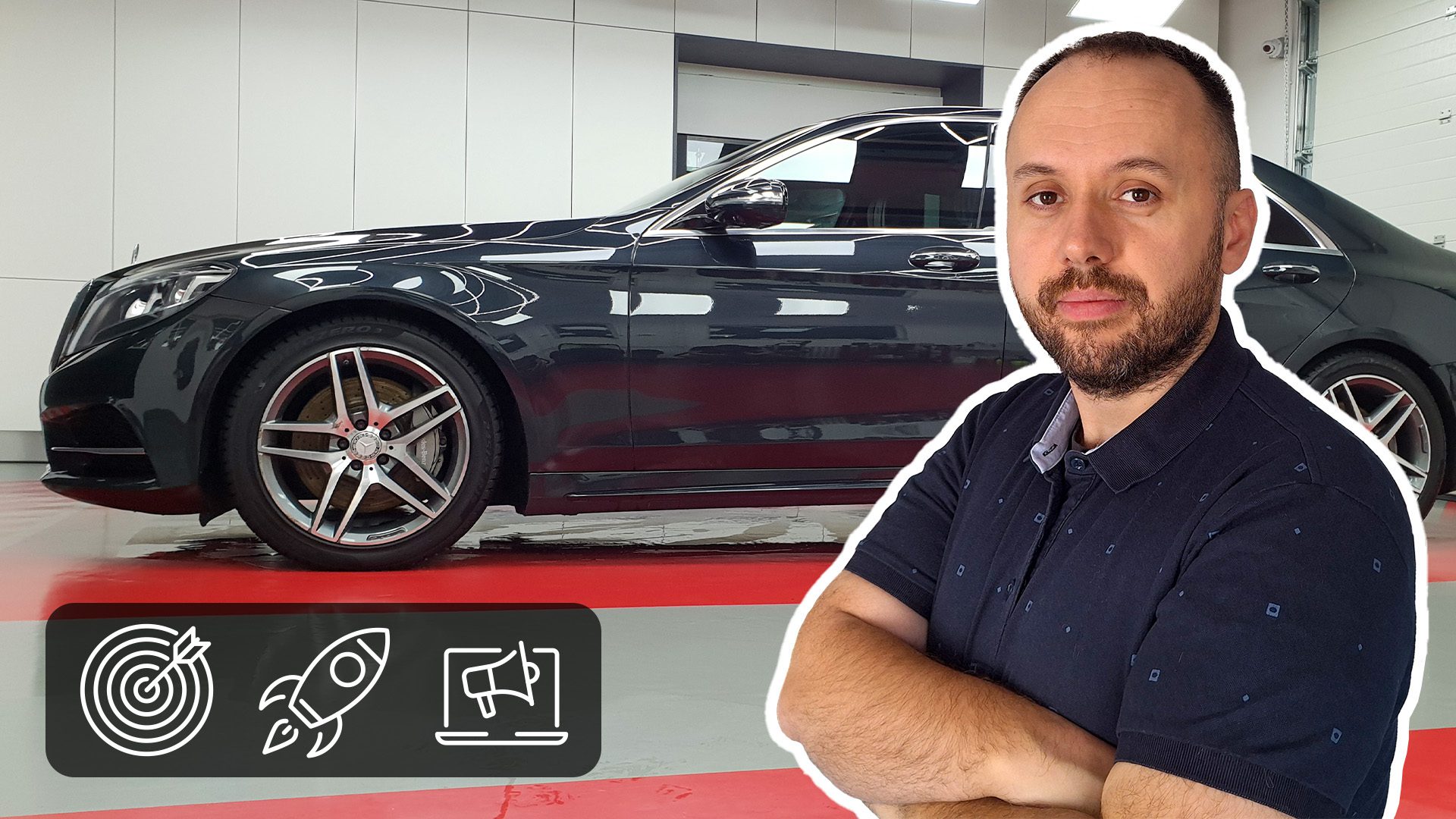 Polished dark car in a bright, clean garage